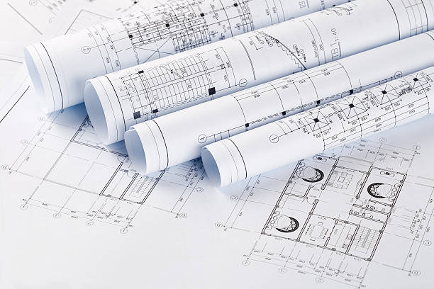 istock rolls of blueprints closeup 484375469