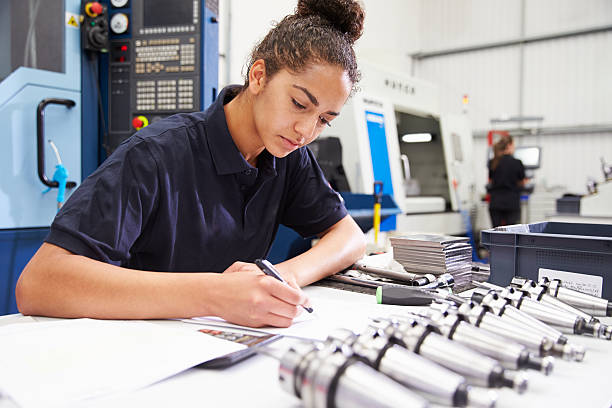 istock Engineer Planning Project With CNC Machinery In Background 484376250