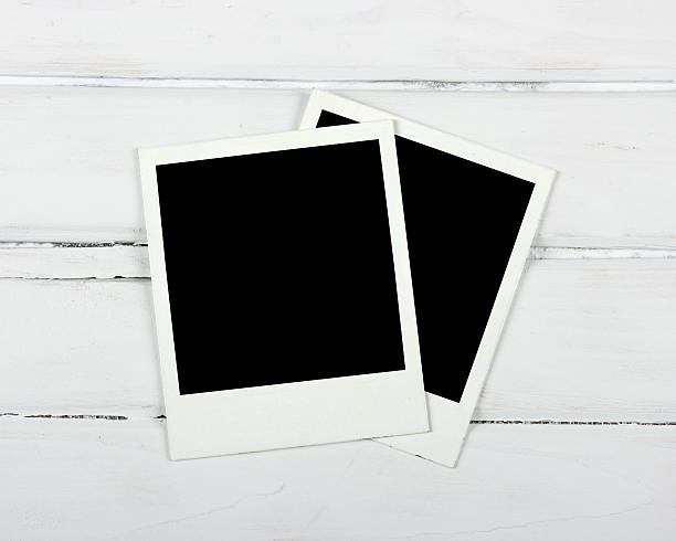 istock Instant photos on wooden table 484376447