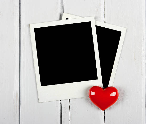 istock Two instant photos with red heart 484376453