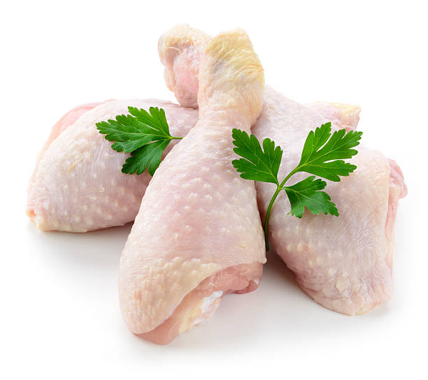istock Raw chicken legs isolated on white background 484376784