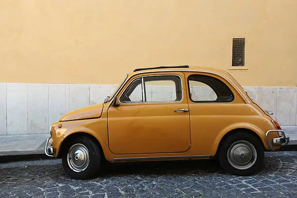 Vintage Fiat 500 parked on street