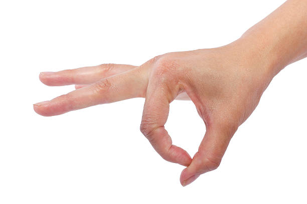 Female Hands Flicking Something on a White Background close up of female human hand flicking for composites verb stock pictures, royalty-free photos & images