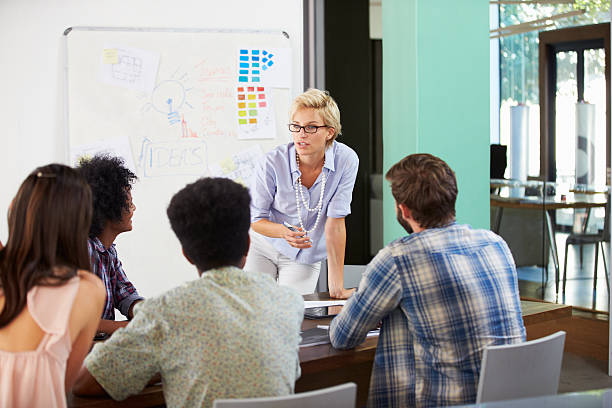 istock Female Manager Leading Brainstorming Meeting In Office 484379404