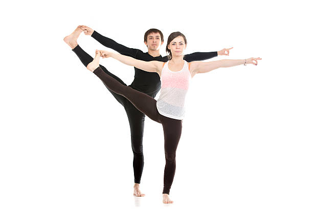 istock Extended Hand-To-Big-Toe yoga pose with partner 484381894
