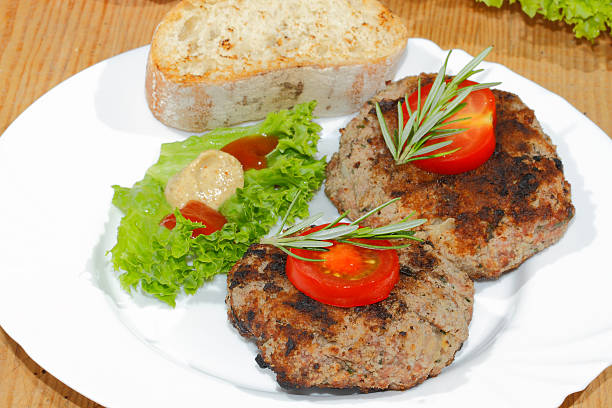 istock Grilled beef patties, spicy sauces, plates 484387148
