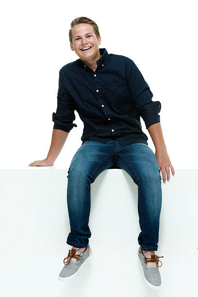 istock Smiling male sitting on box 484389796