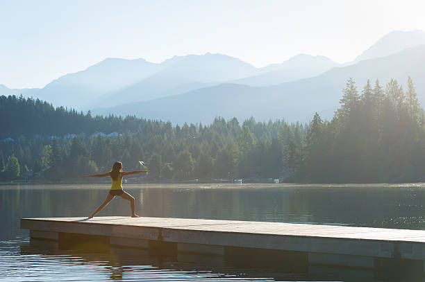 istock Warrior Two Tranquil Lakeside meditation at sunrise 484393284