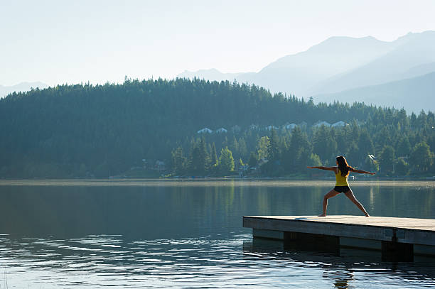 istock Warrior Two Tranquil Lakeside meditation at sunrise 484393298