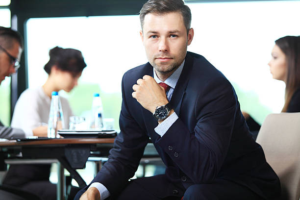 istock Businessman with colleagues in the background 484393636