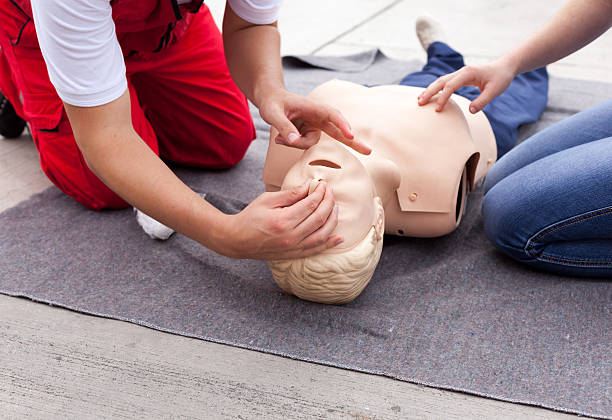 First aid First aid training detail. Cardiopulmonary resuscitation (CPR). first aid class stock pictures, royalty-free photos & images