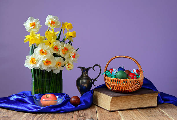 istock Easter eggs in a basket and flowers 484398757