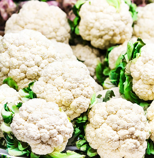 istock Fresh raw cauliflower on market close up. 484399215