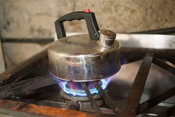 kettle on gas flame cooker large flame