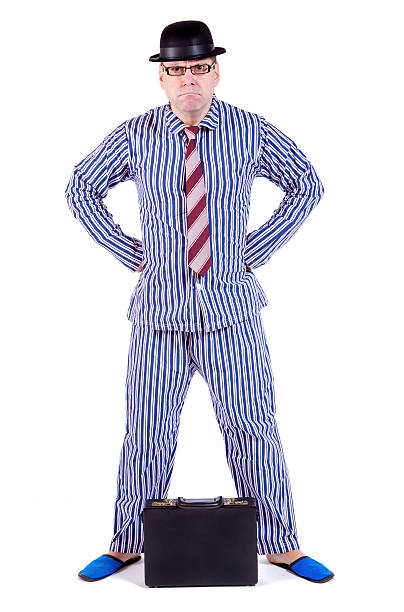 istock man in pajamas with suitcase 484400218