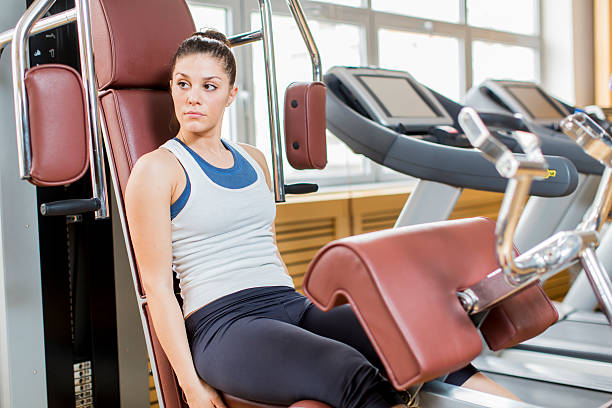 istock Young woman in the gym 484400279