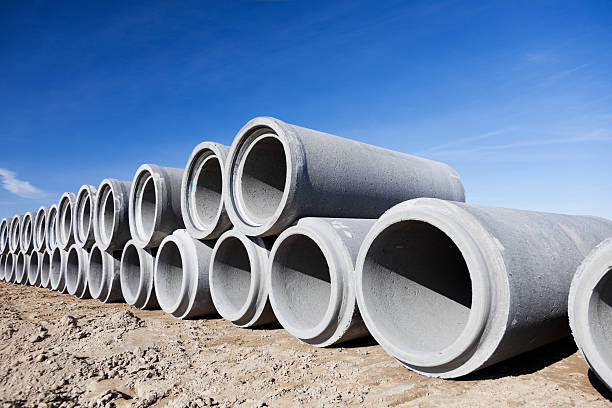 Concrete pipes on building site. Blue sky