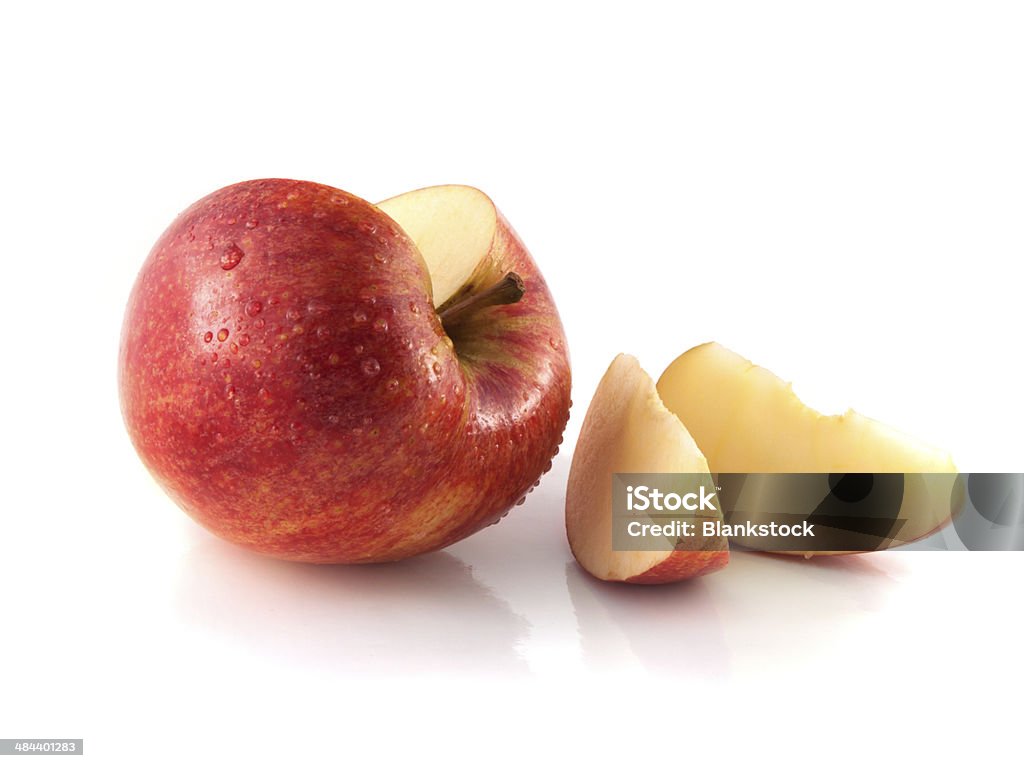 Isolated sliced red apple with two slices (wet) Isolated sliced red apple with two slices (wet). Fresh diet apple. Healthy fruit with vitamins. Agriculture Stock Photo