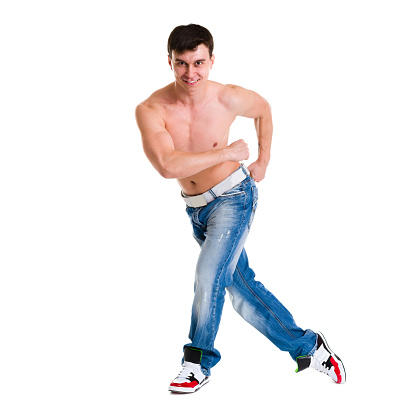 Handsome young man dancing isolated on white background in full body