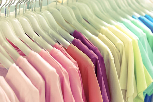 istock Colorful t-shirt on hangers 484403302