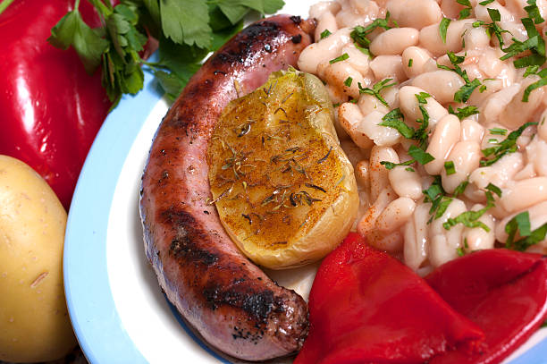 Spanish cuisine. Pork sausage with beans, Catalan style