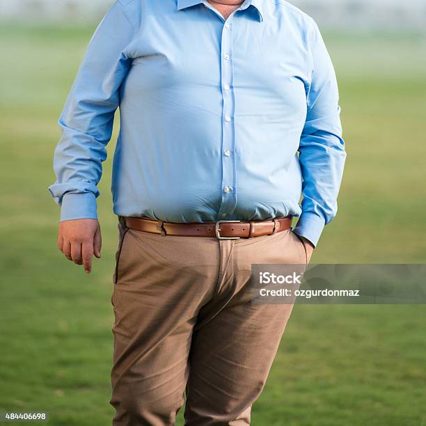 Mid Section Of An Overweight Mature Man Stock Photo - Download Image Now - 2015, 30-39 Years, Adult