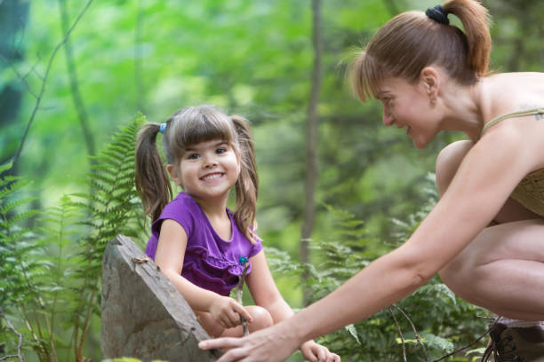 istock Mother and Daughter Looking for Bugs 484406922