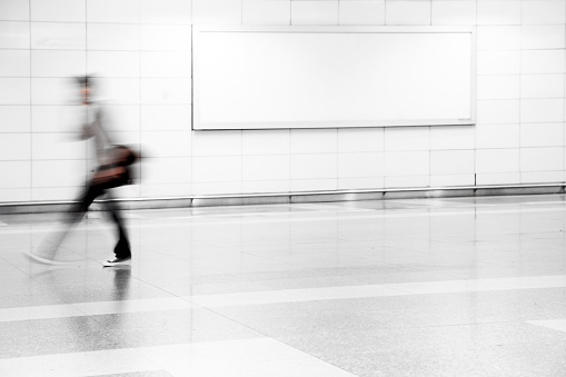Abstract, blured motion image of a commuter. 