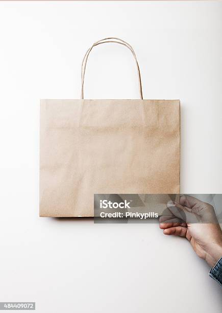 Mockup Of Craft Shopping Bag Stock Photo - Download Image Now - 2015, Adult, Arranging