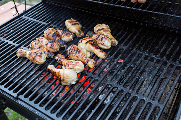 istock chicken legs on the barbecue 484409092