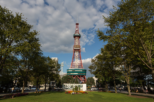 Sapporo, Hokkaido, Japan - August 27, 2014 : People at Odori Park, Sapporo, Hokkaido, Japan. Throughout the year, many events are held in the Odori Park. The Sapporo TV Tower have an observation deck, souvenir shop and restaurant. It is a famous tourist attraction in Sapporo. 