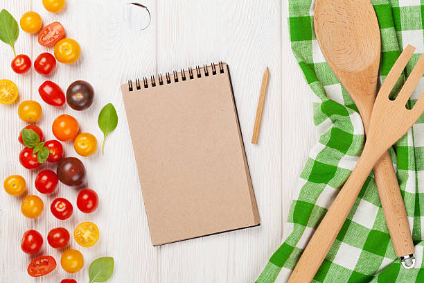 istock Colorful cherry tomatoes and kitchen utensils 484416660