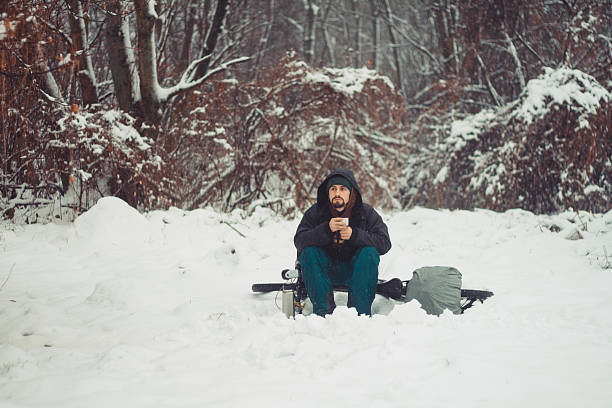 istock Pensive cyclist is resting on a glade at winter 484419796
