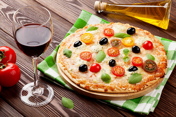 istock Italian pizza and red wine 484419882
