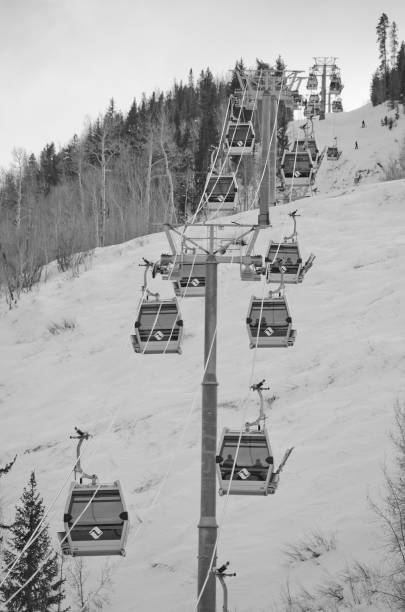 Cable car above the fog on the way to the top of the ski slope.