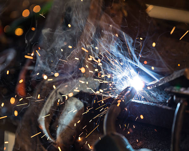 istock Welder in action with bright sparks. 484424198