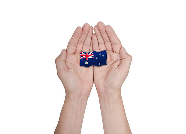 istock Hands protecting the national flag of Australia 484424400