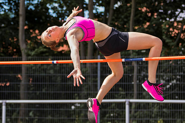 high jump in track and field woman in high jump in track and field womens field event stock pictures, royalty-free photos & images