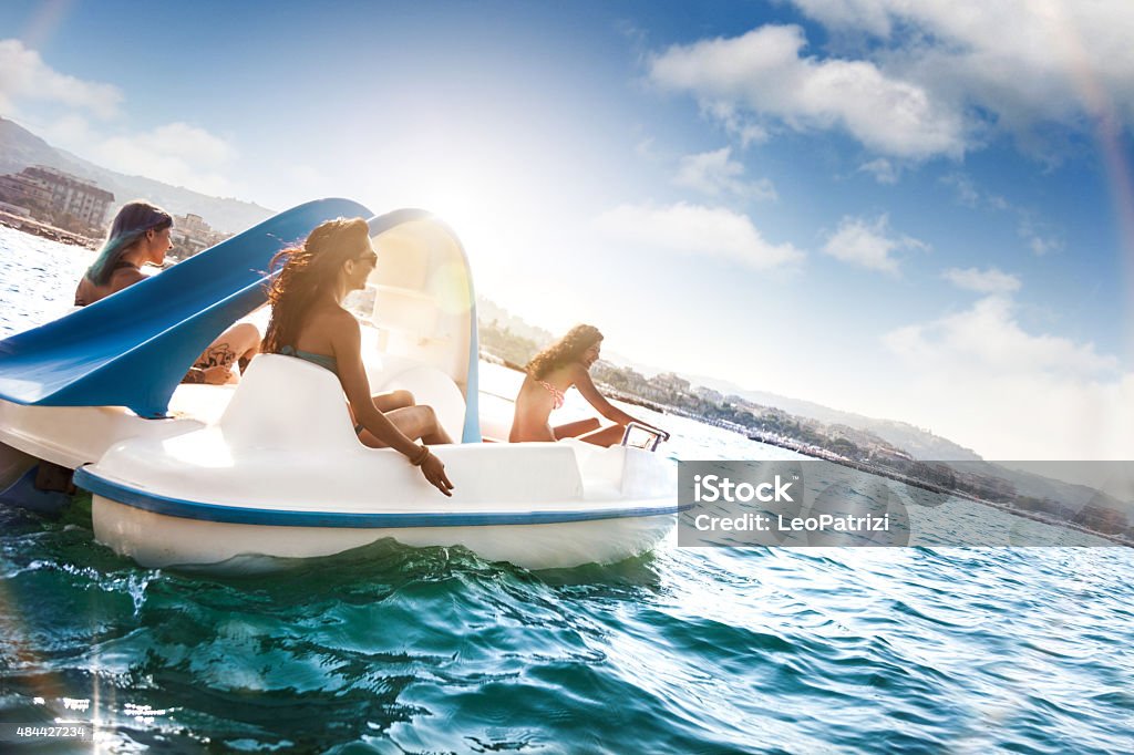 Best friend enjoying summer and pedalo fun Best friend enjoying summer and pedalo fun during vacations. Pedal Boat Stock Photo