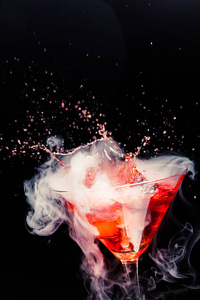 istock red cocktail with splash and ice vapor 484427949