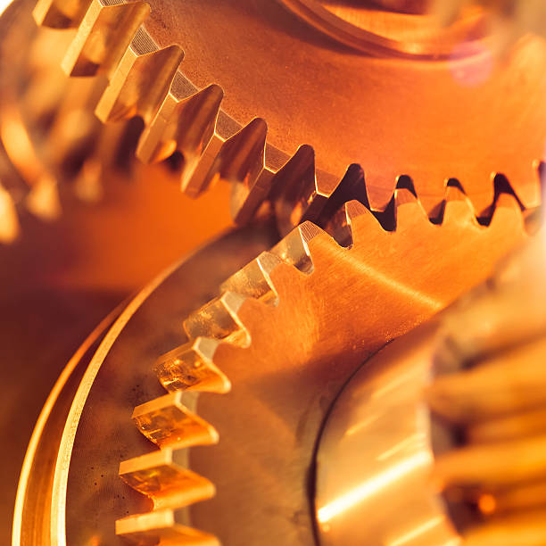 istock golden gear wheels, close-up 484428407
