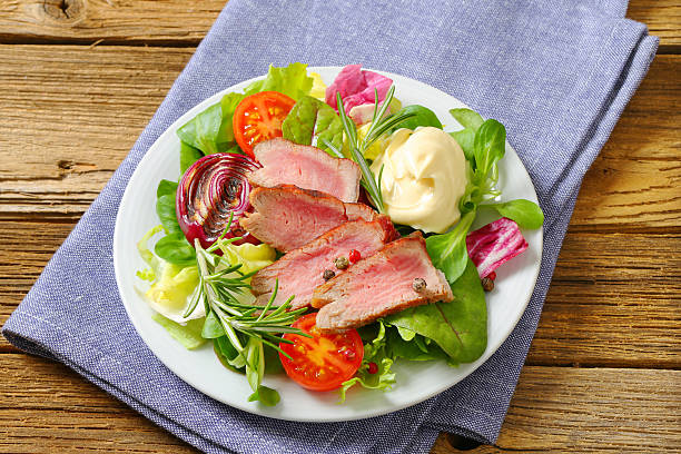 istock Grilled fillet mignon with vegetable salad 484429107