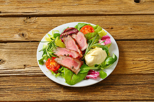 istock Grilled fillet mignon with vegetable salad 484429165
