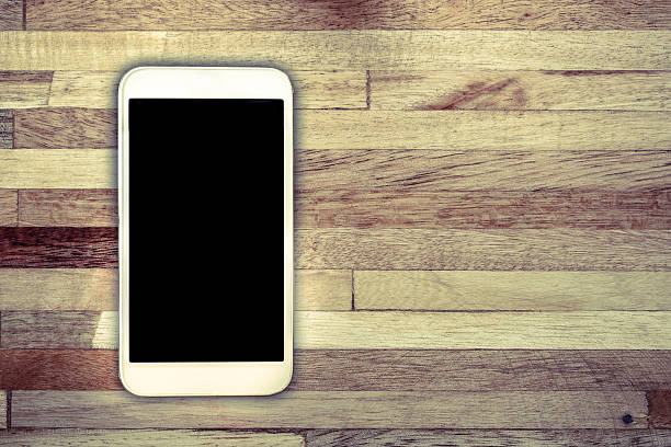 istock White smart on wooden desk 484432104