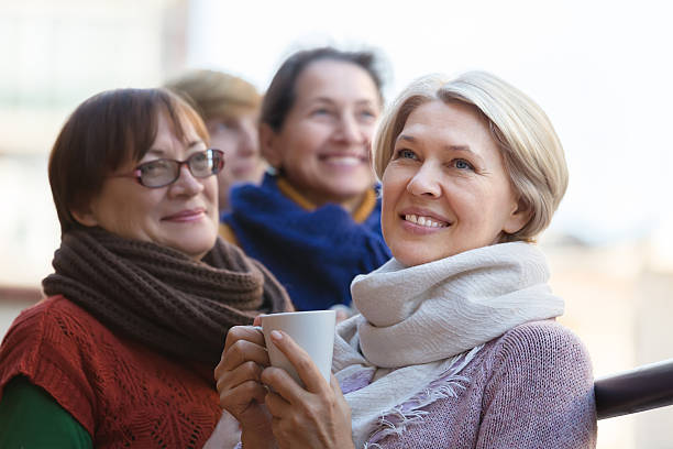 istock Senior women drinking tea at balcony 484432604