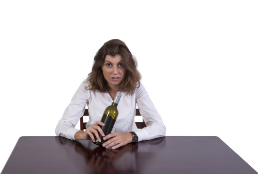 Image of a drunk businesswoman at work against white background