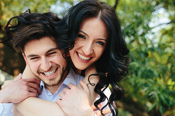 istock Woman Embracing Her Boyfriend From Behind 484441300