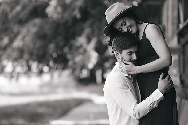 istock man and woman embracing each other 484441308