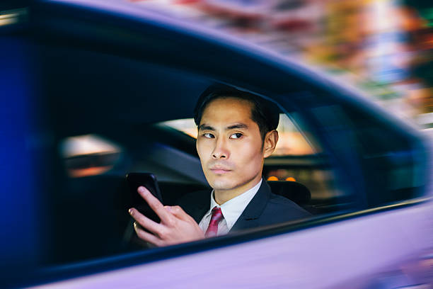 istock Businessman texting in a car 484441690