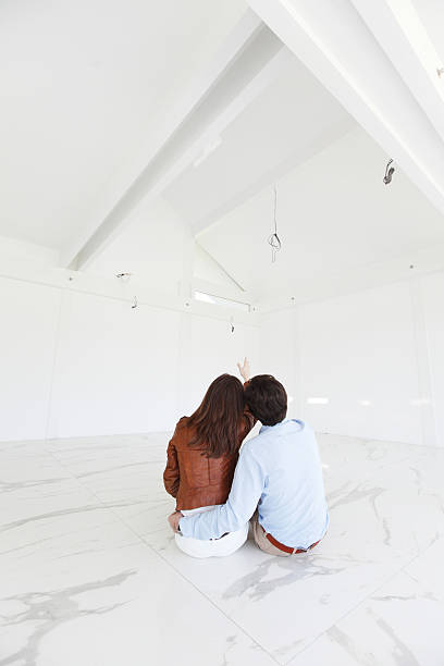 istock young couple in a new house 484444394